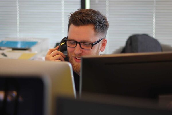 man calling a shipper and posing as a legitimate freight broker