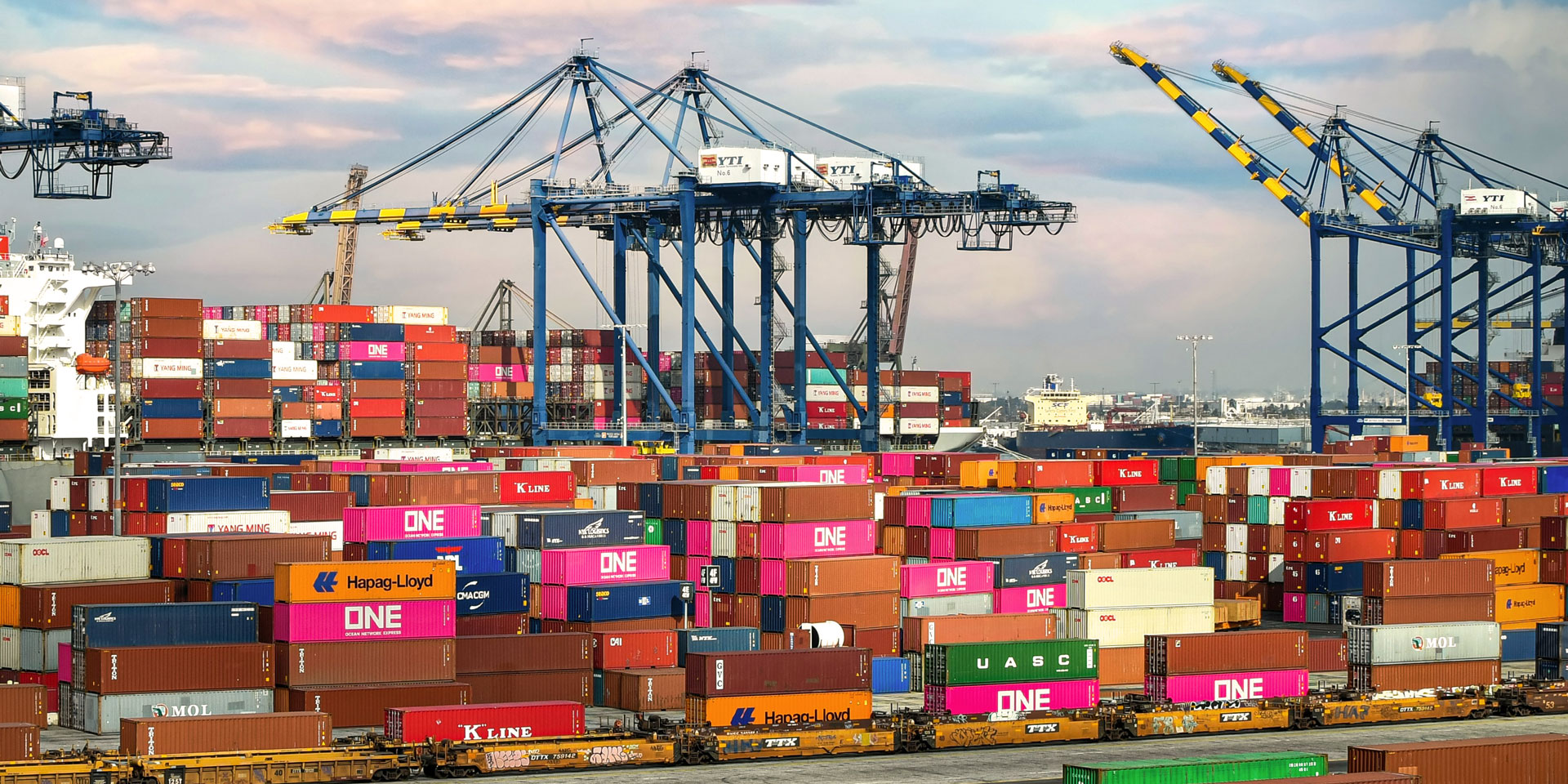 stacked containers and cranes at a California port
